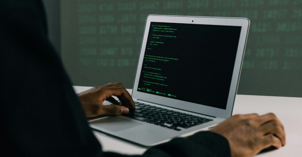 Hands on laptop keyboard illustrating cybersecurity incident recovery services