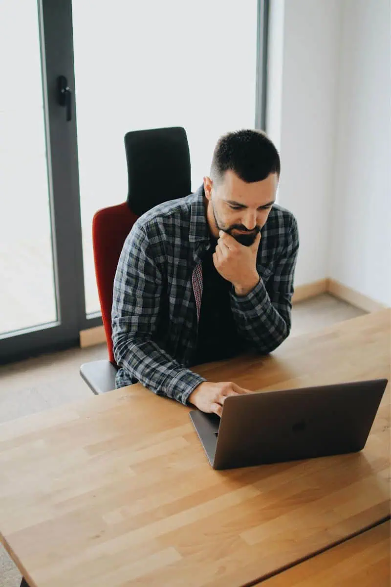 Man with laptop at desk